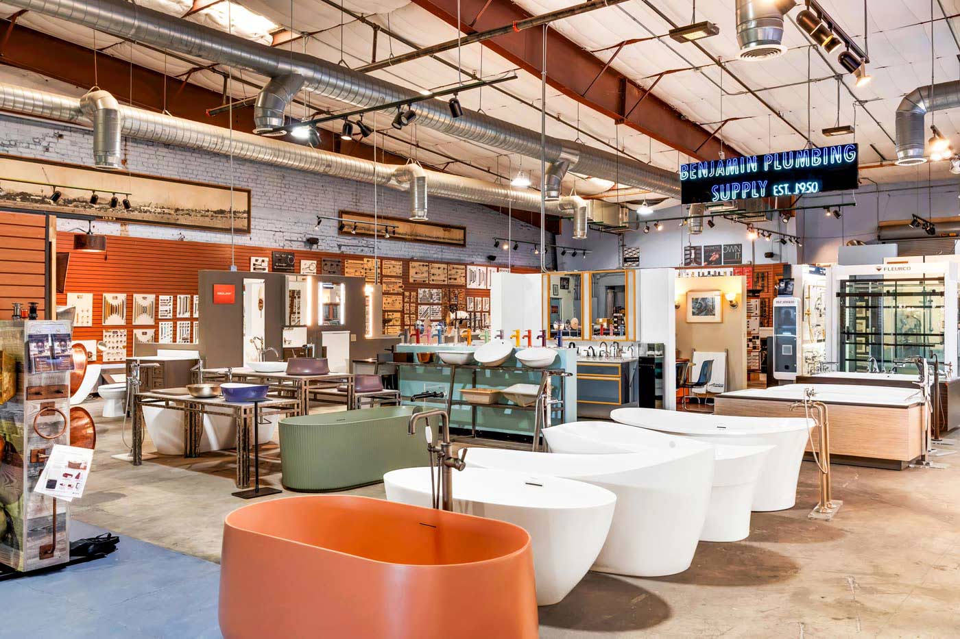 A spacious furniture store showcasing a variety of styles and types of furniture arranged throughout the store.