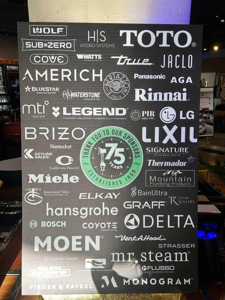 Sponsor board listing logos including Wolf, Sub-Zero, Toto, Brizo, and others.