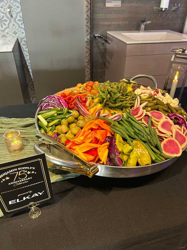 Large silver platter filled with pickled vegetables and crudités, sponsored by Elkay.