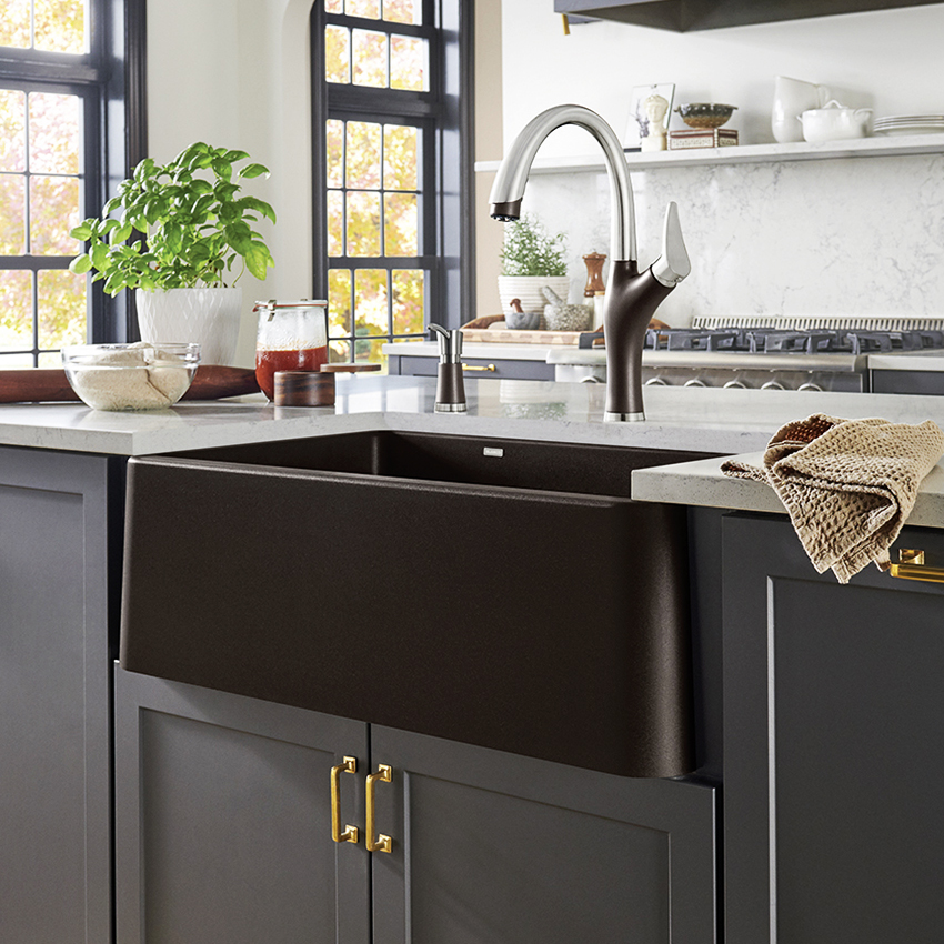 A black Silgranit sink with accessories