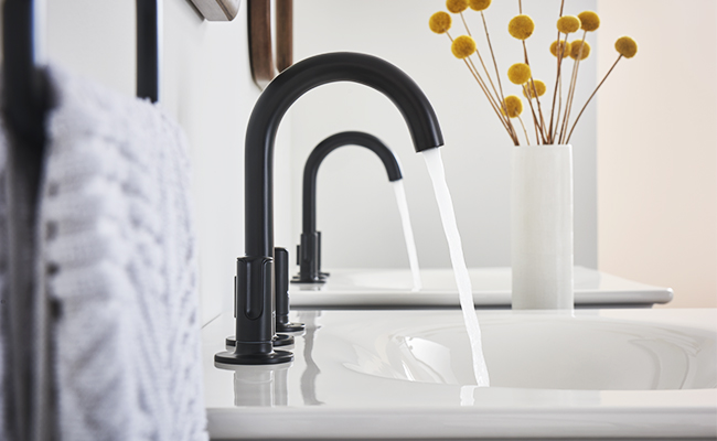 The black matte faucet in the bathroom
