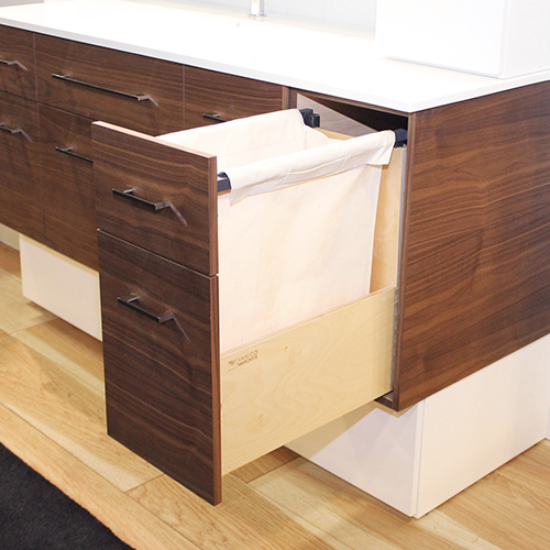 Laundry basket concealed in the vanity