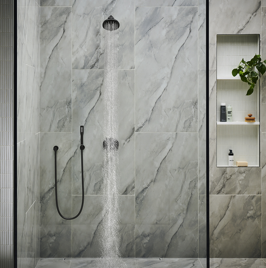 A shower with a matte black faucet