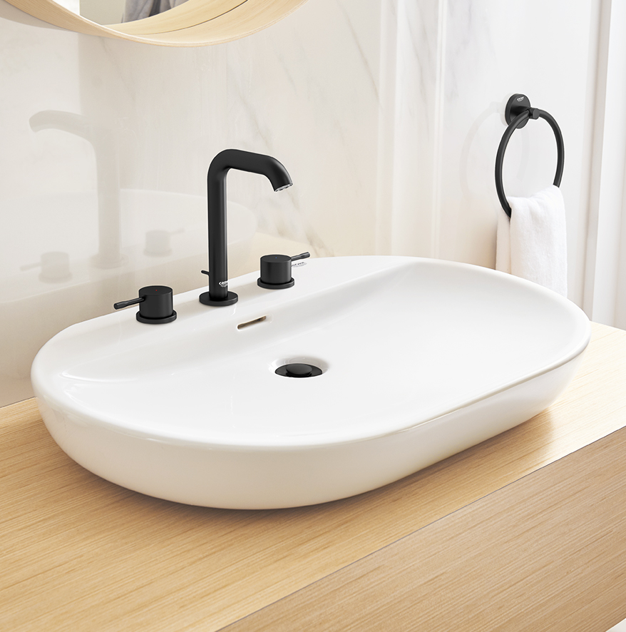 A sink with a matte black faucet