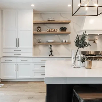 Contemporary kitchen with stylish cabinetry and elegant lighting