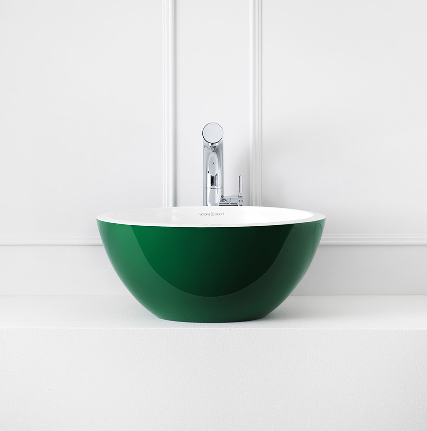 A green and round top-mount sink