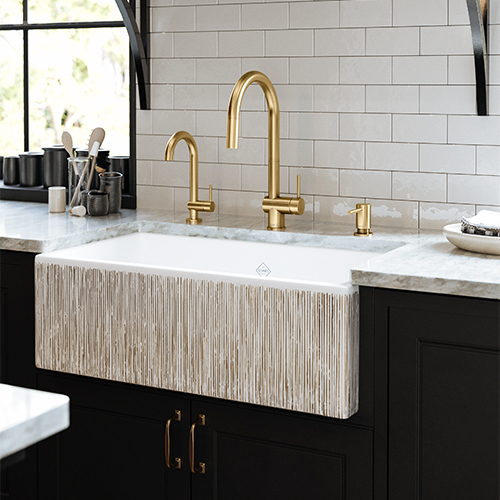 Shaw Single Bowl Shaker Fireclay Sink with Gold Stripe Pattern and Riobel Azure Kitchen Faucets