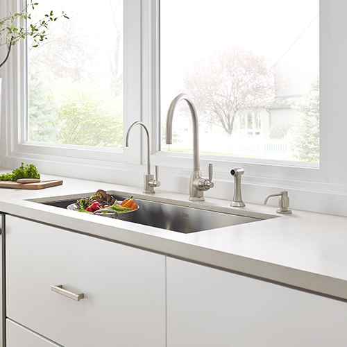 Single bowl stainless steel sink with accessories from Rohl