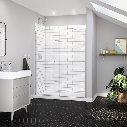 Reveal Sleek shower door in chrome finish and Utile Metro Tux shower wall by MAAX