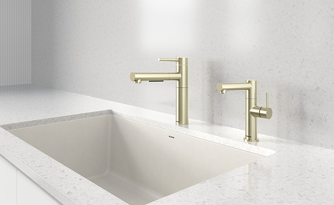 Gold kitchen and bar faucet.