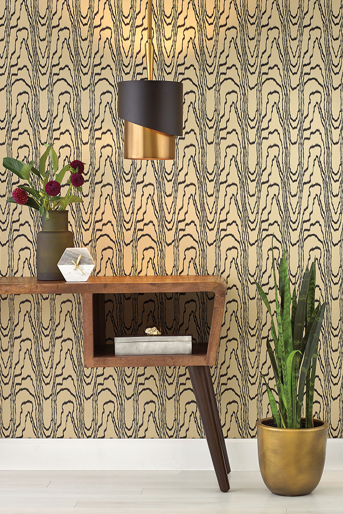 Entry hall with gold wallpaper and modern gold and bronze pendant 