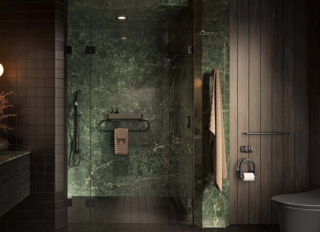 A modern walk-in shower with dark green tiles, black fixtures, and a glass door.