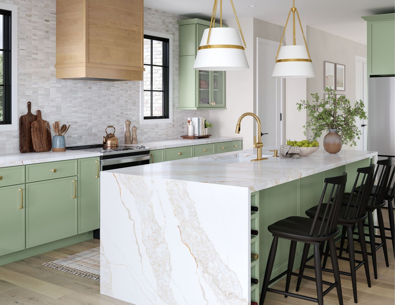 A modern kitchen featuring green cabinets and sleek white countertops.