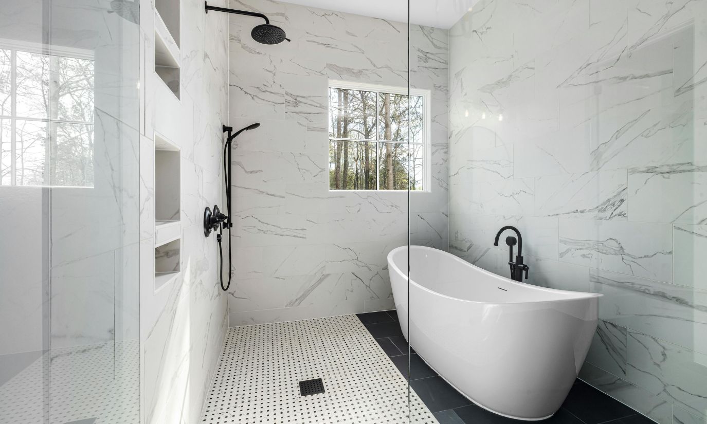 A modern bathroom featuring a spacious tub and a sleek shower, showcasing contemporary design elements and fixtures